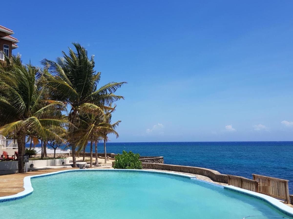 Whispering Seas Oceanfront Suite أوشو ريوس المظهر الخارجي الصورة